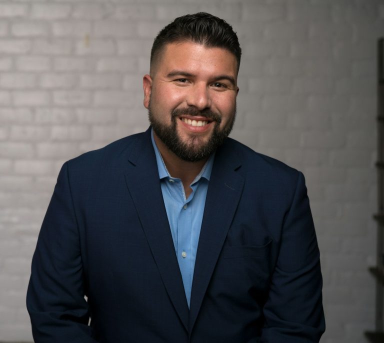 man in blue suit jacket