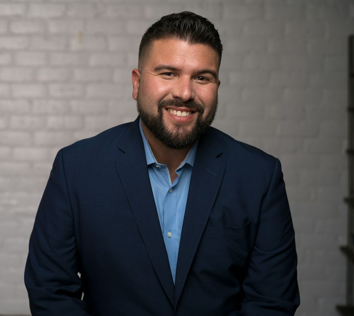 man in blue suit jacket